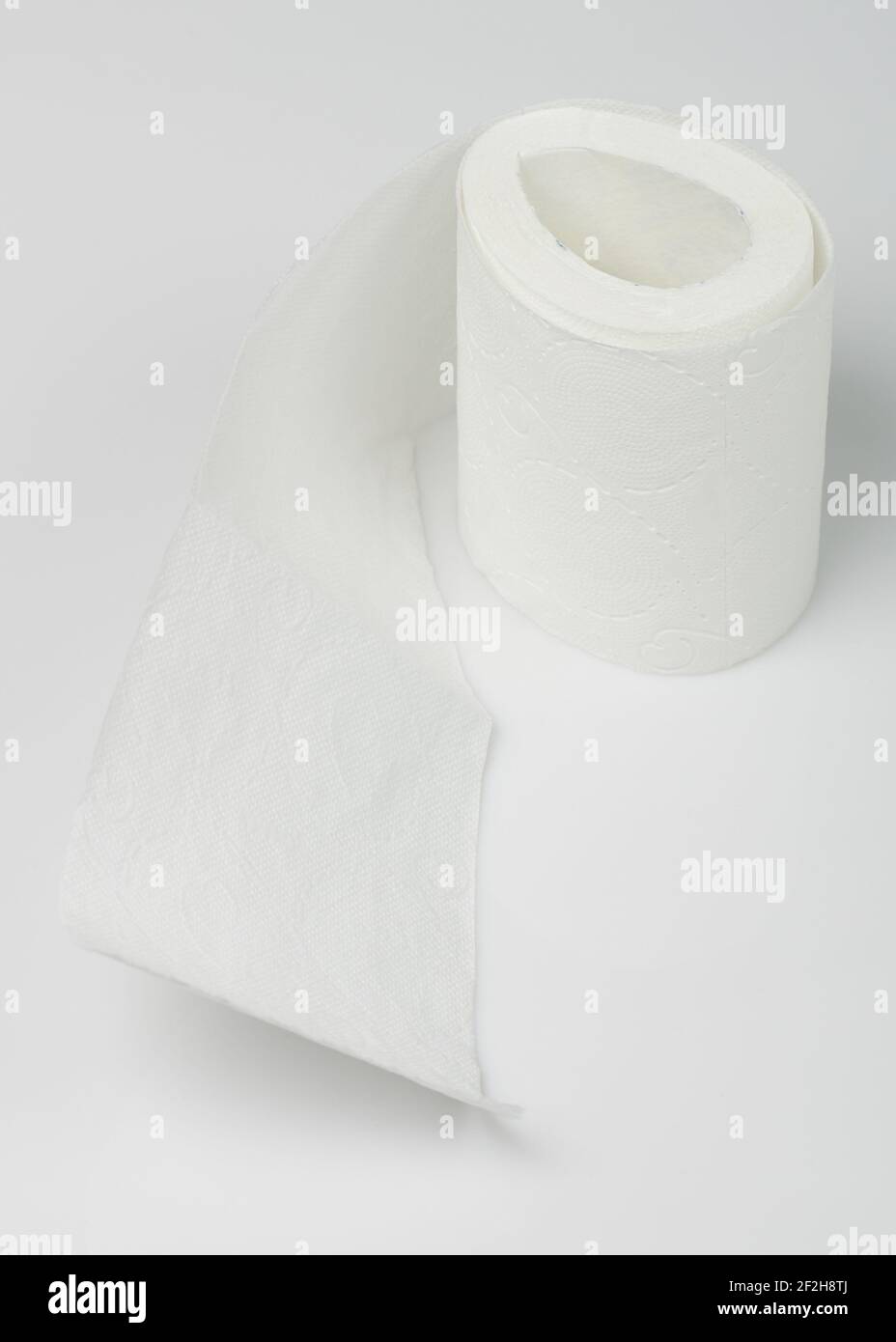 Edge of toilet paper on white studio background Stock Photo