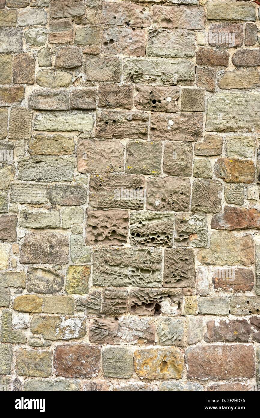 Eroded block of stone in a wall Stock Photo - Alamy