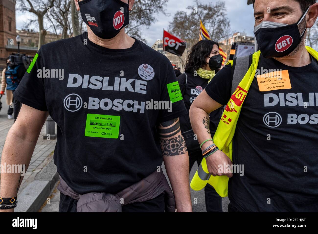 Two workers are seen wearing T-shirts with the protest slogan Dislike Bosch  during the demonstration.Workers of the German multinational Bosch of the  Llisa d'Amunt factory (Catalonia) affected by the crisis in the