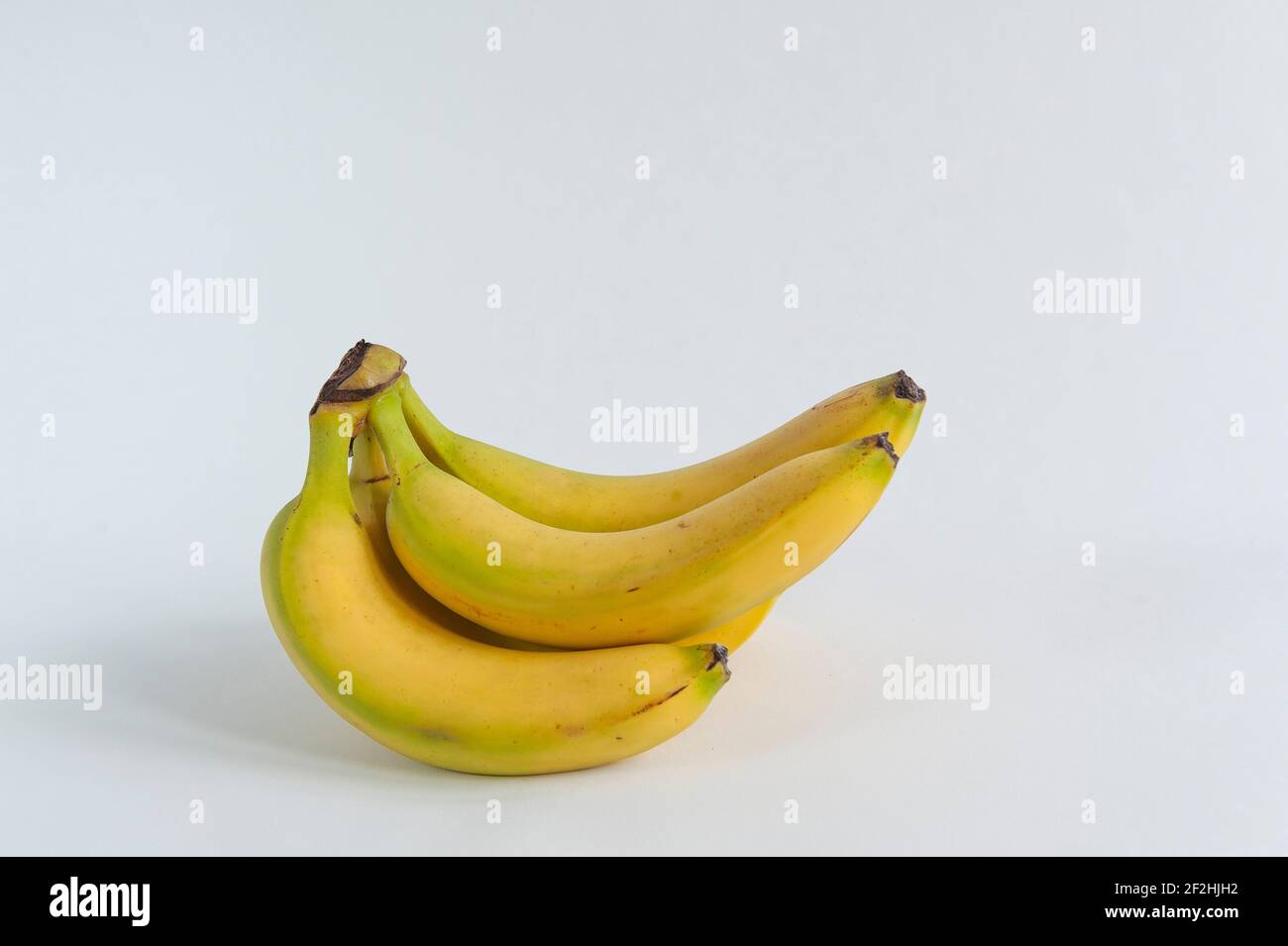 https://c8.alamy.com/comp/2F2HJH2/a-bunch-of-bananas-on-a-white-background-2F2HJH2.jpg