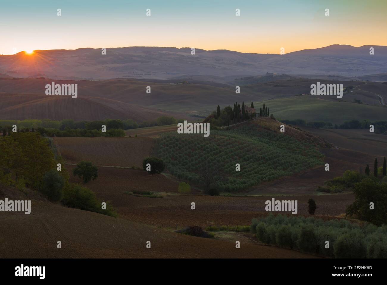 TUSCANA, ITALY - SEPTEMBER 21, 2017: Dawn rural landscape with the old villa Podere Belvedere. Neighborhoods of the city of San Quirico d'Orcia Stock Photo
