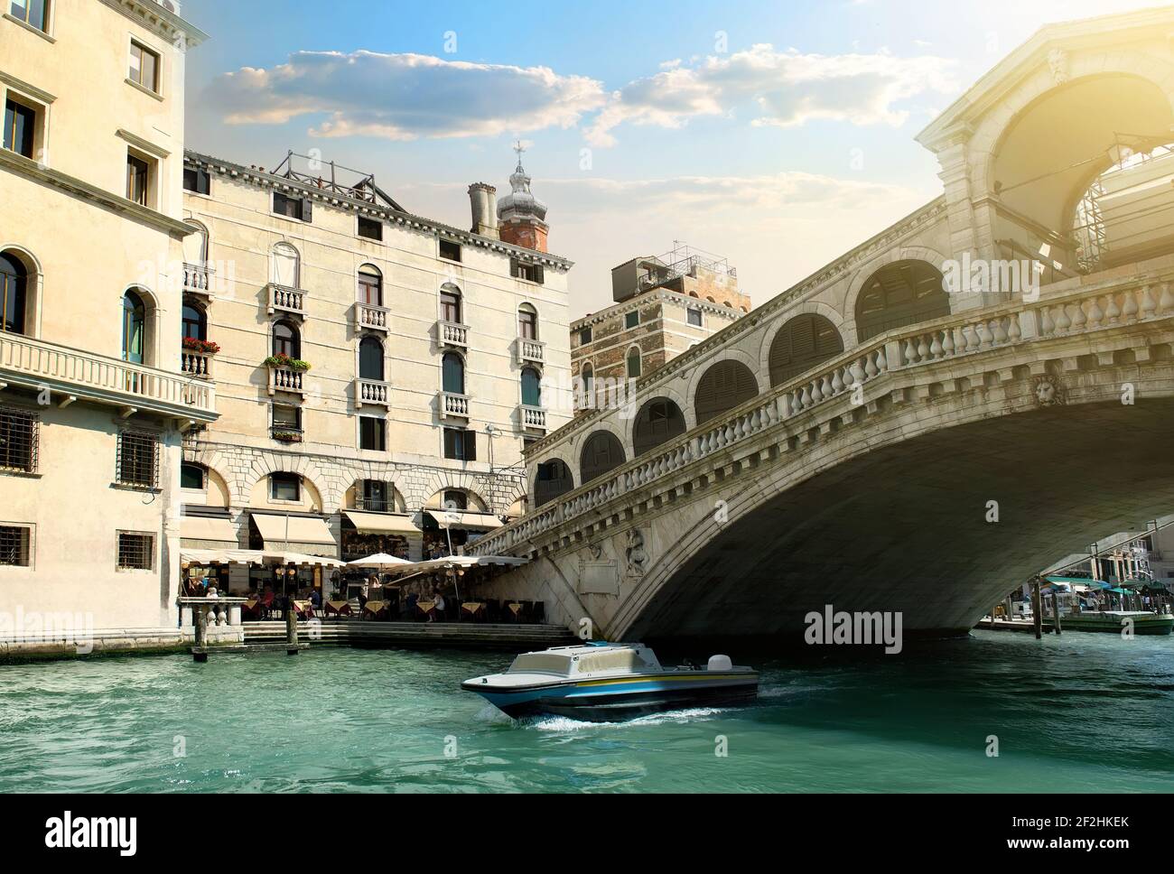 Rialto bridge and ship in Venice, Italy Stock Photo