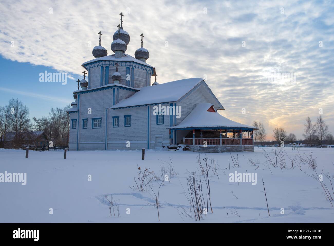 Old Epiphany Church in Stoletovskaya (Lyadiny) village on a cloudy February morning. Arkhangelsk oblast, Russia Stock Photo