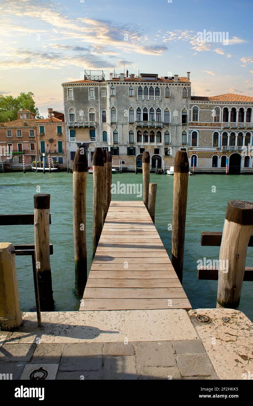 Small wooden jetty on Grand Canal in Venice Stock Photo