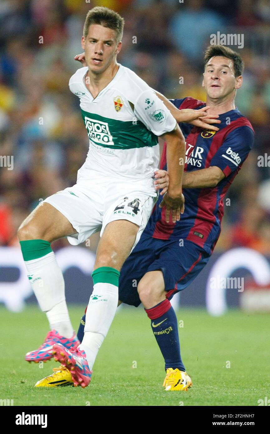 FC Barcelona 3-0 Elche, Leo Messi (BAR) and Mario Pasalic (ELC) during La Liga soccer match between FC Barcelona and Elche CF, at the Camp Nou stadium in Barcelona, Spain, Sunday, august 24, 2014. Photo Bagu Blanco / DPPI Stock Photo