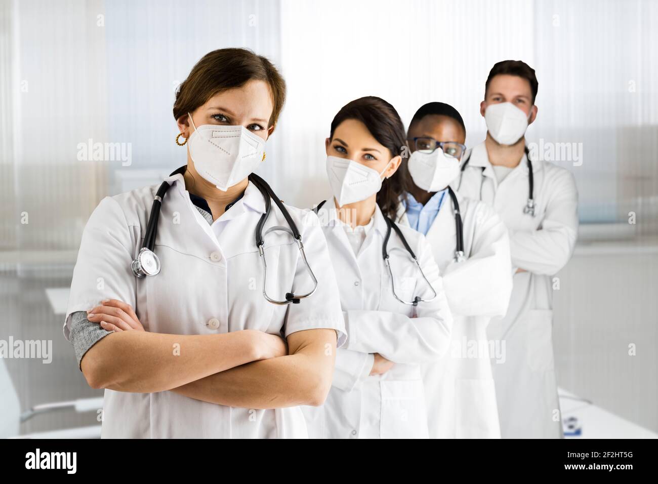 Medical Healthcare Doctor Group In Hospital Wearing FFP2 Face Mask