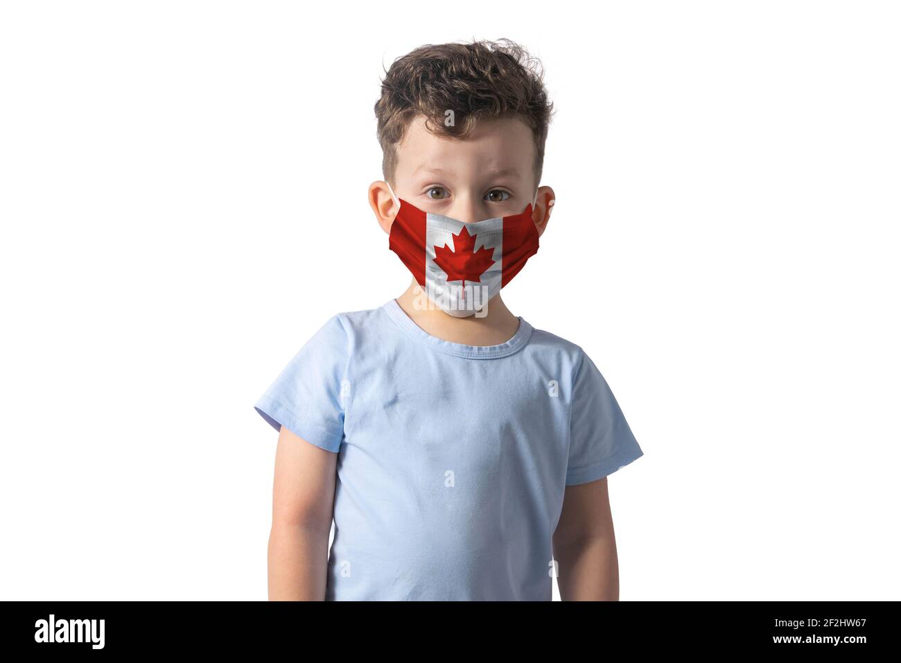 Respirator with flag of Canada White boy puts on medical face mask isolated on white background. Stock Photo