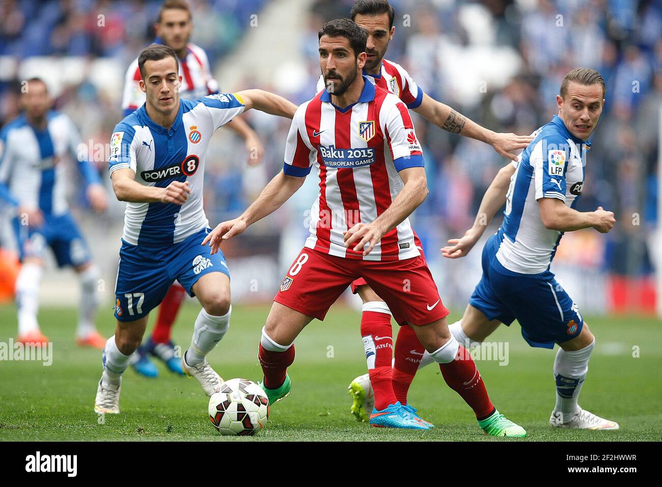 Raul Garcia of Atletico and Lucas Vazquez (left) and Abraham Gonzalez of Espanyol during the Spanish Championship Liga football match between Espanyol and Atletico de Madrid on March 14, 2015 at Power 8 stadium in Barcelona, Spain. Photo Bagu Blanco / DPPI Stock Photo