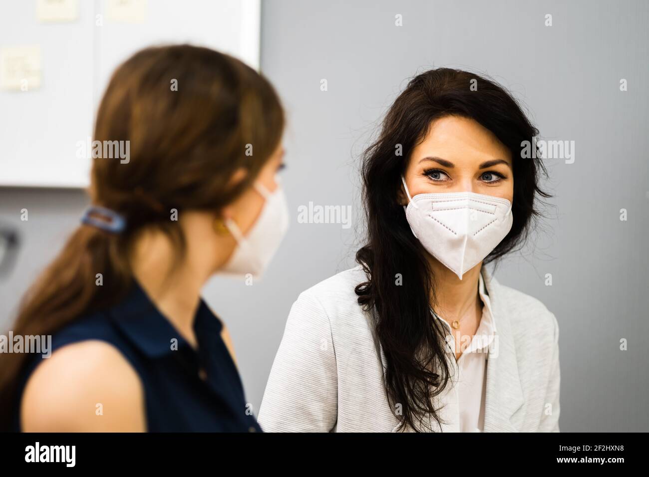 Woman Ladies Friends Talking In Face Mask Stock Photo