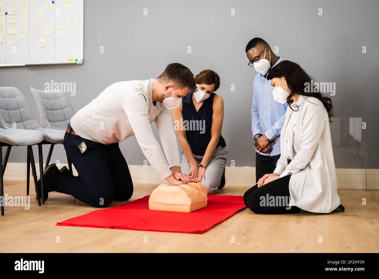 First Aid CPR Resuscitate Training In Face Mask Stock Photo