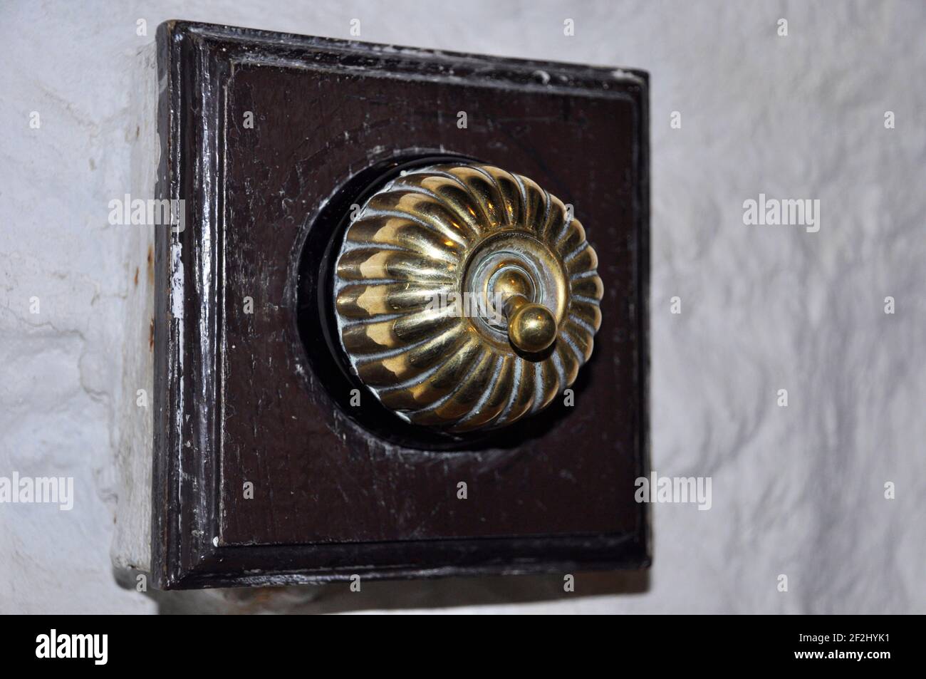 Brass electric light switch in the East Pool copper and tin Mine, Taylors shaft pump house,Redruth. Cornwall.UK Stock Photo