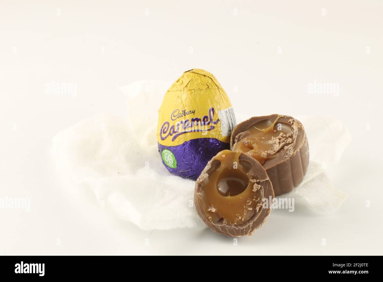 Cadburys caramel eggs, and Cadbury trademark logo. Cadbury is owned by Mondelez International Stock Photo