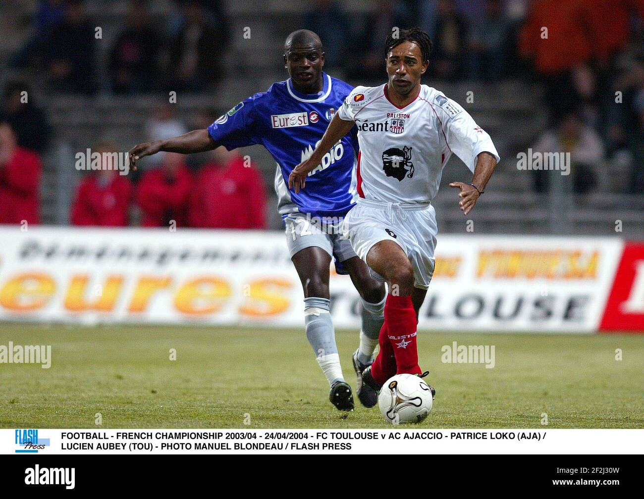 FOOTBALL - FRENCH CHAMPIONSHIP 2003/04 - 24/04/2004 - FC TOULOUSE v AC AJACCIO - PATRICE LOKO (AJA) /= LUCIEN AUBEY (TOU) - PHOTO MANUEL BLONDEAU / FLASH PRESS Stock Photo