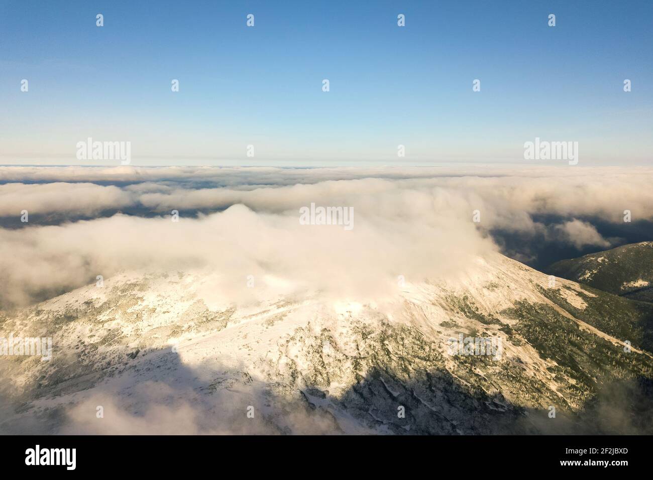 Aerial view flying through snowy hi-res stock photography and images ...