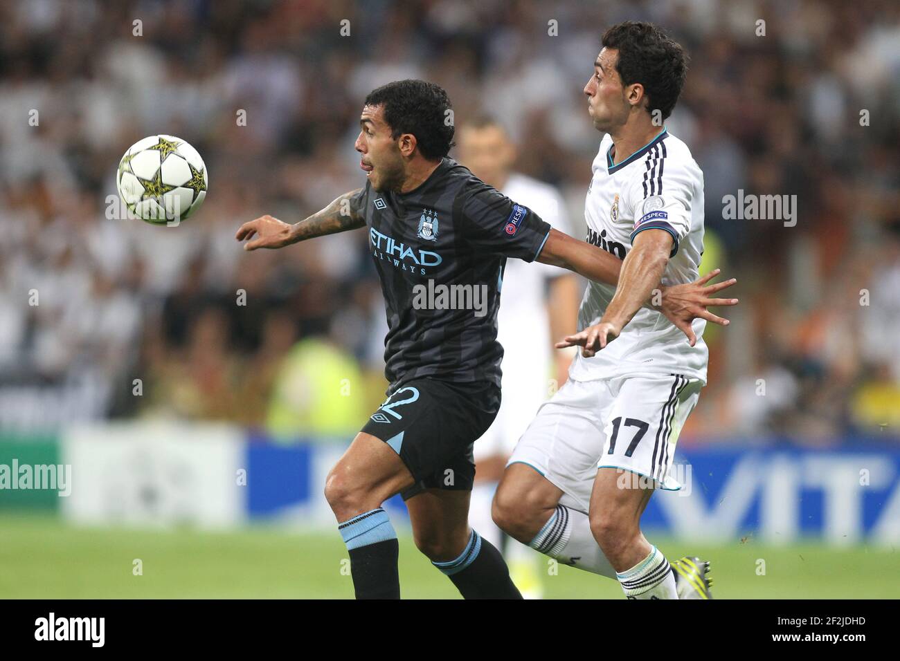 FOOTBALL - UEFA CHAMPIONS LEAGUE 2012/2013 - GROUP STAGE - GROUP D - REAL MADRID v MANCHESTER CITY - 18/09/2012 - PHOTO MANUEL BLONDEAU / AOP PRESS / DPPI - CARLOS TEVEZ AND ALVARO ARBELOA Stock Photo