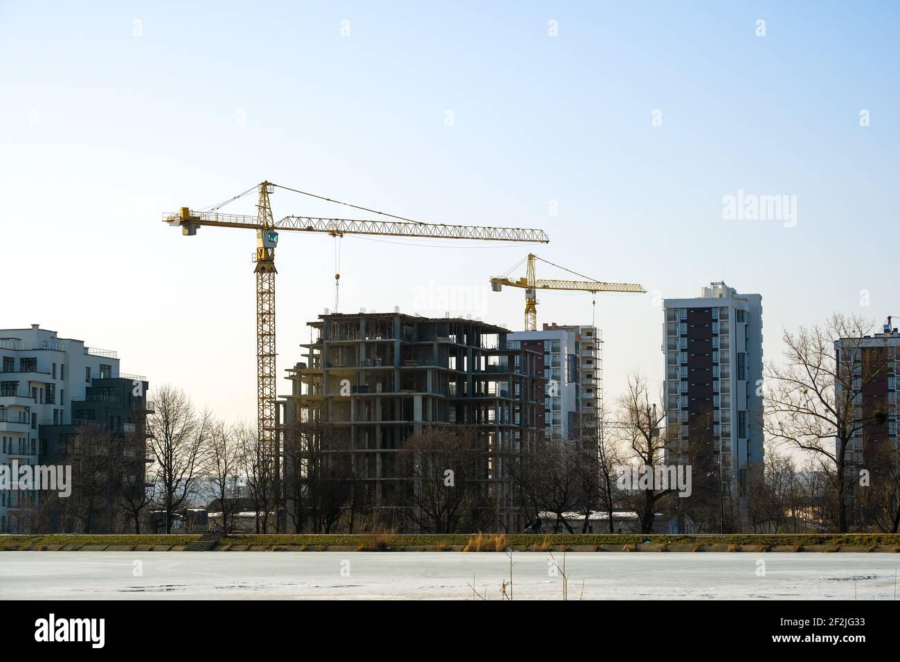 Aerial view of tower cranes and high residential apartment buildings ...