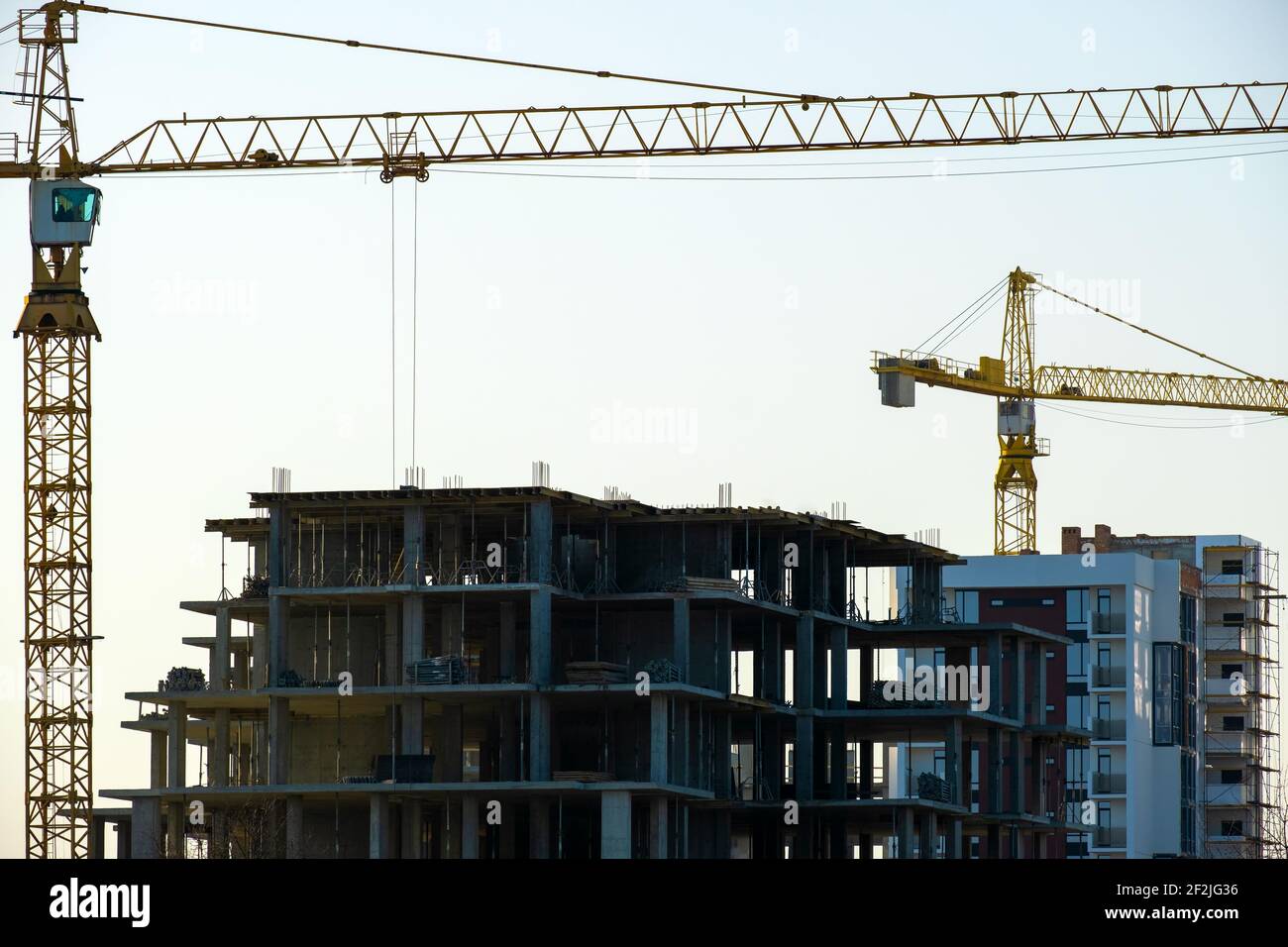 Aerial view of tower cranes and high residential apartment buildings ...