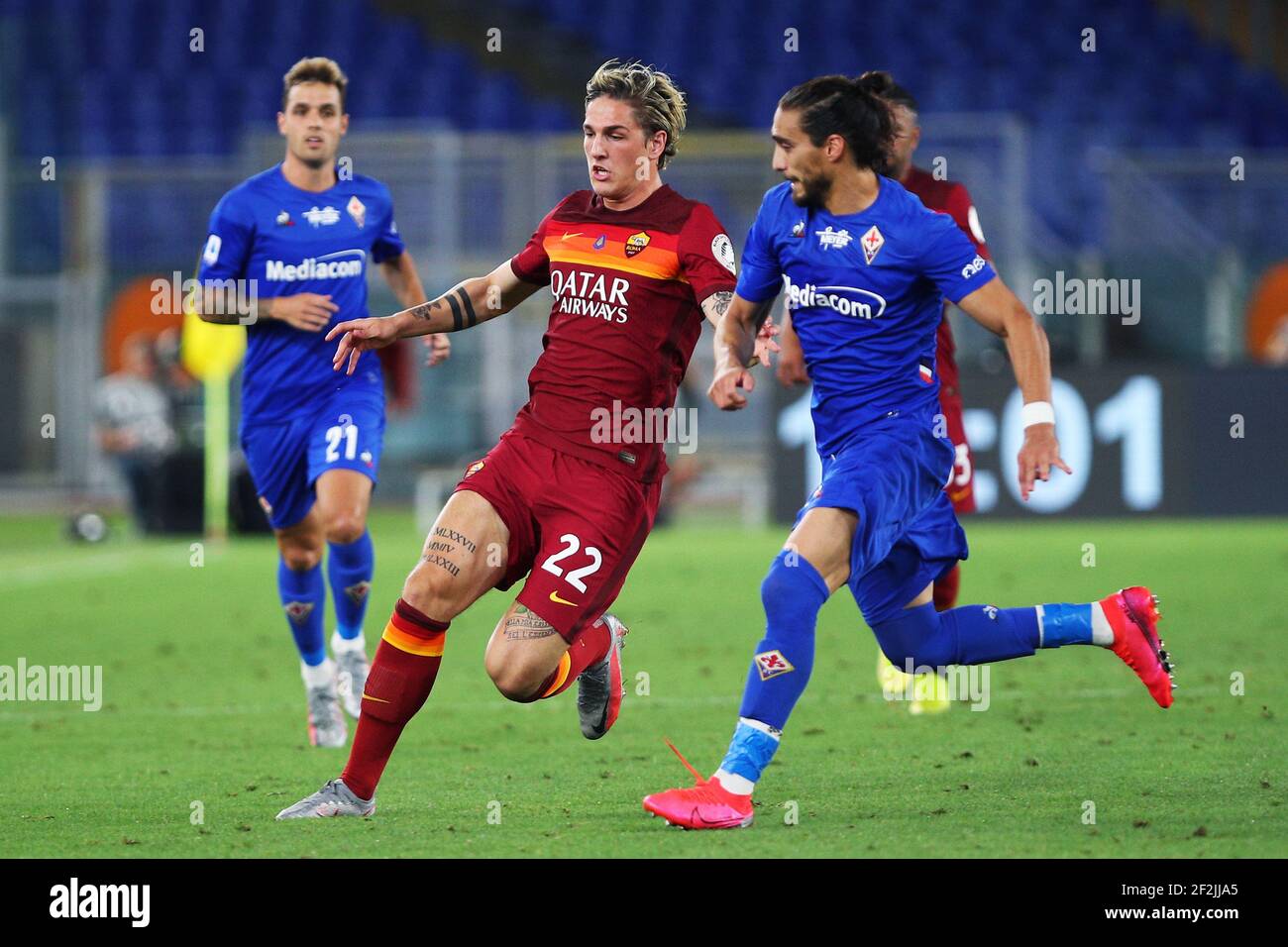 Nicolo' Zaniolo of Roma (L) vies for the ball with Martin Caceres of Fiorentina (R) during the Italian championship Serie A football match between AS Roma and ACF Fiorentina on July 26, 2020 at Stadio Olimpico in Rome, Italy - Photo Federico Proietti / DPPI Stock Photo