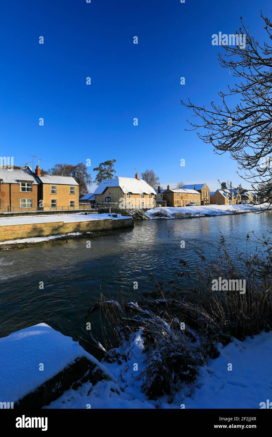 Winter snow over houses on the river Welland, Deeping St James town