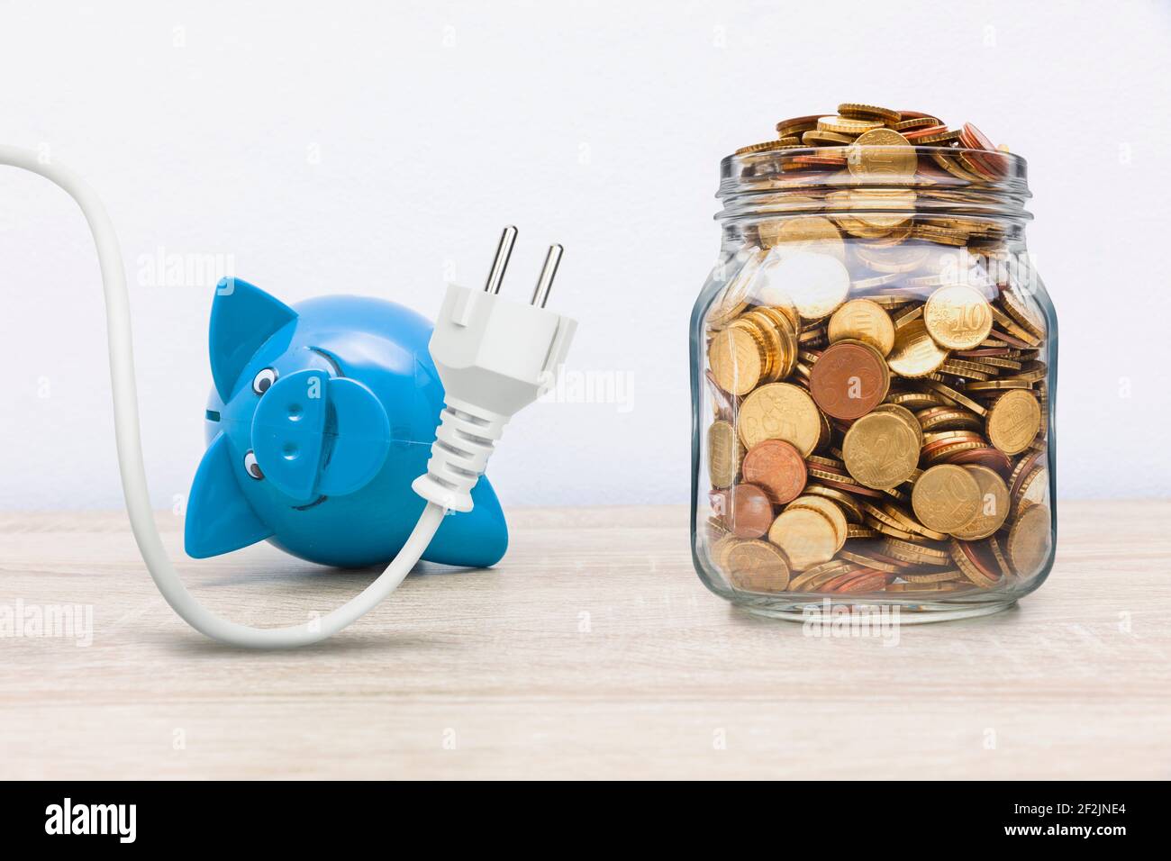 Piggy bank with socket hi-res stock photography and images - Alamy