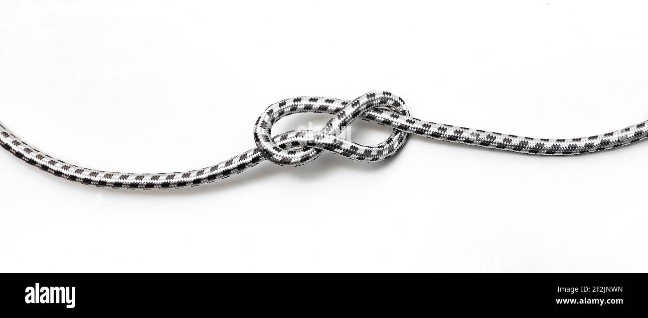 Knot in a power cable on a white background Stock Photo
