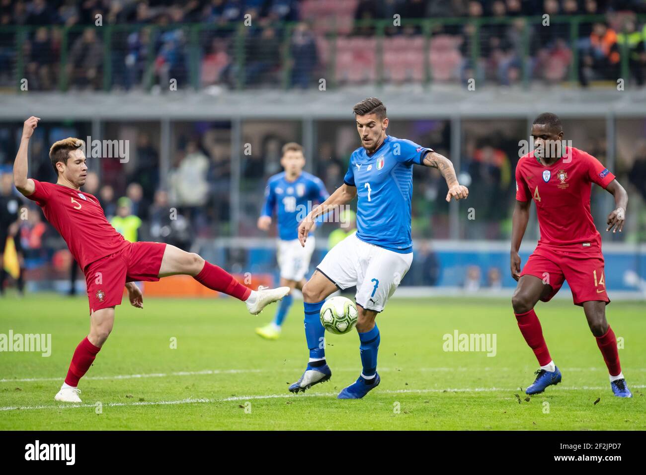 Lorenzo Pellegrini of Italy and Raphael Guerreiro, William Carvalho of Portugal during the UEFA Nations League 2018, League A, Group 3 football match between Italy and Portugal on November 17, 2018 at Giuseppe Meazza stadium in Milan, Italy - Photo Morgese - Rossini / DPPI Stock Photo