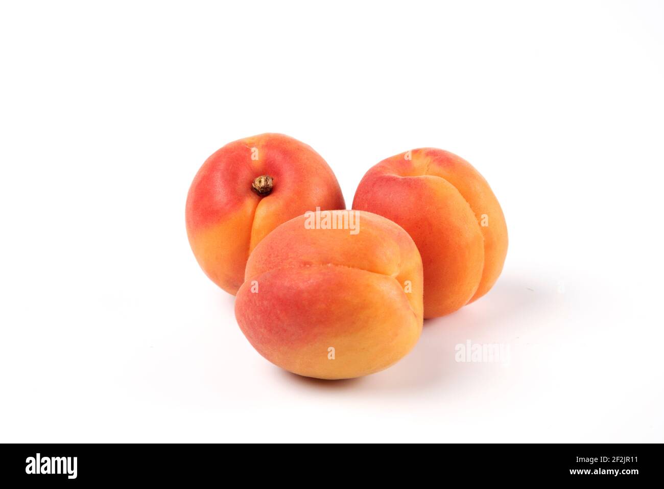 Three peaches isolated on white background macro view Stock Photo