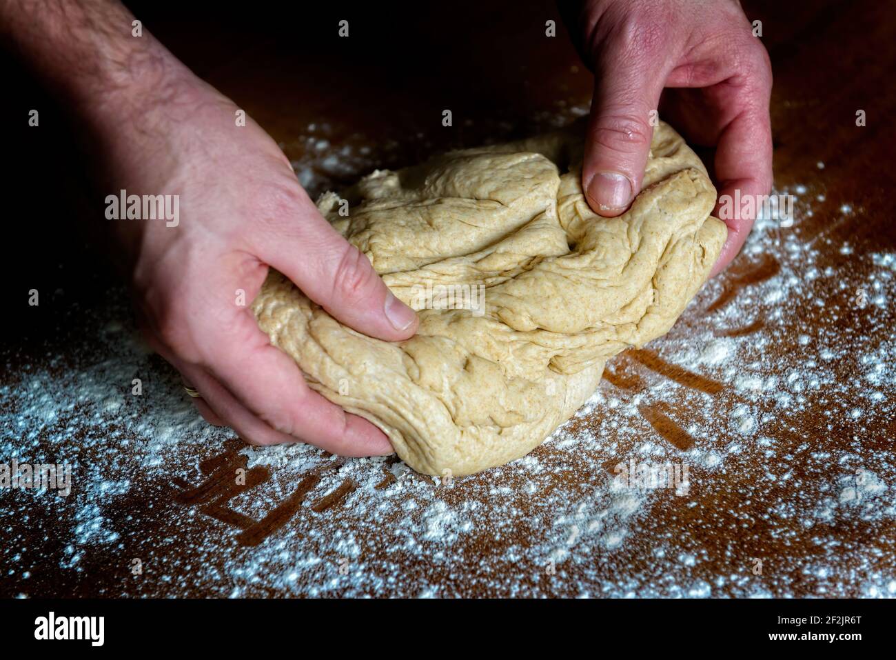 Preparing dough for white bread, rolls, pizza. Yeast dough made from