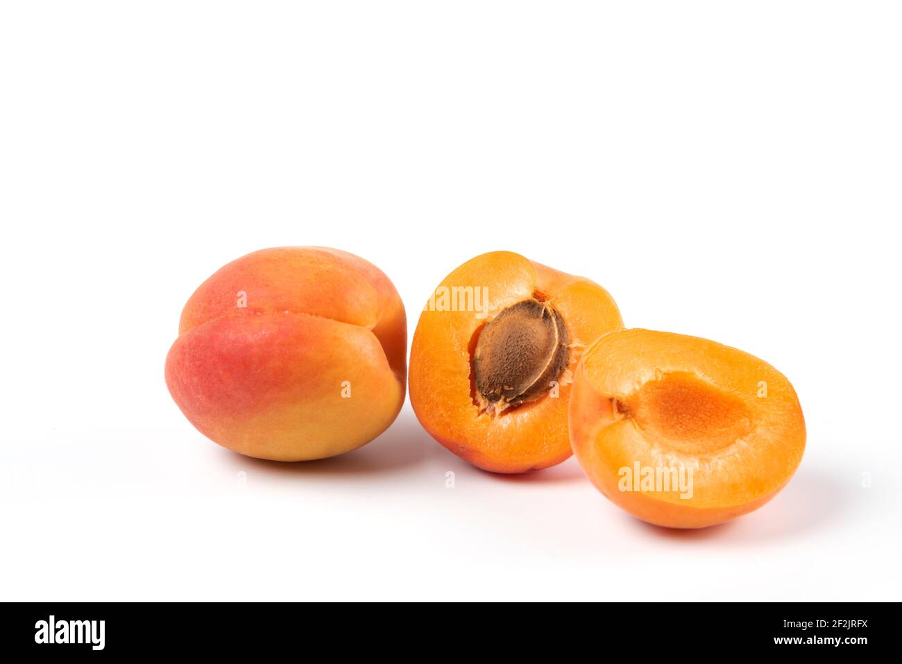 Two yellow peaches isolated on white background Stock Photo