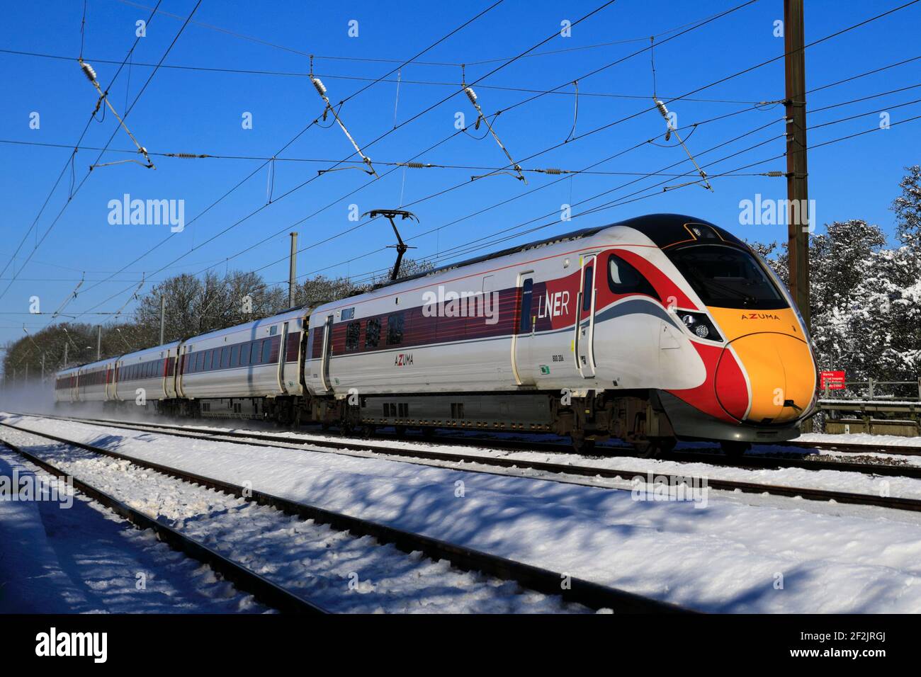 Class 800, LNER Azuma train in snow, East Coast Main Line Railway, Peterborough, Cambridgeshire, England, UK Stock Photo