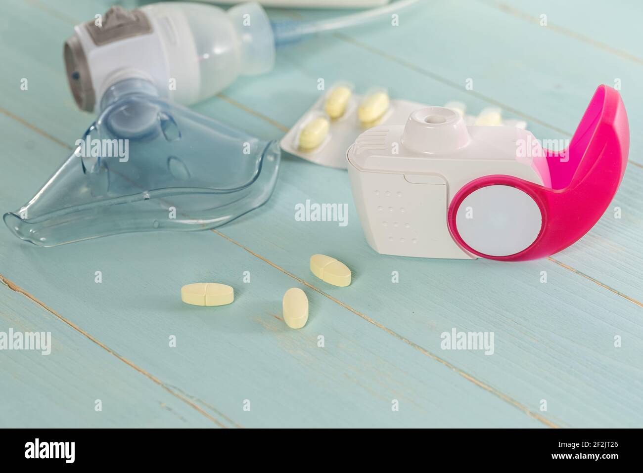 Set of asthma inhaler, antiallergy pills and aerosol machine with