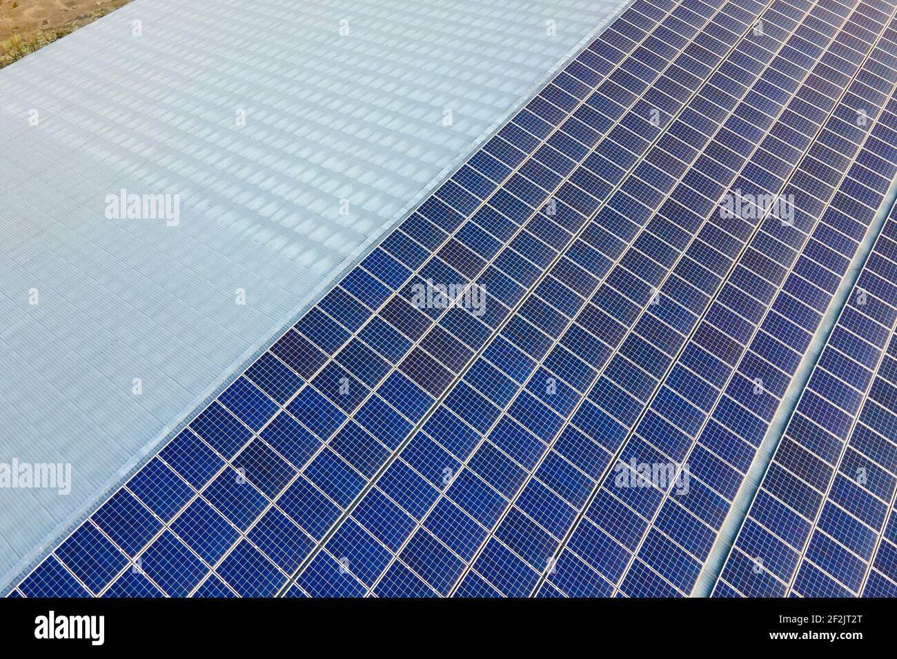 Closeup of surface of blue photovoltaic solar panels mounted on ...