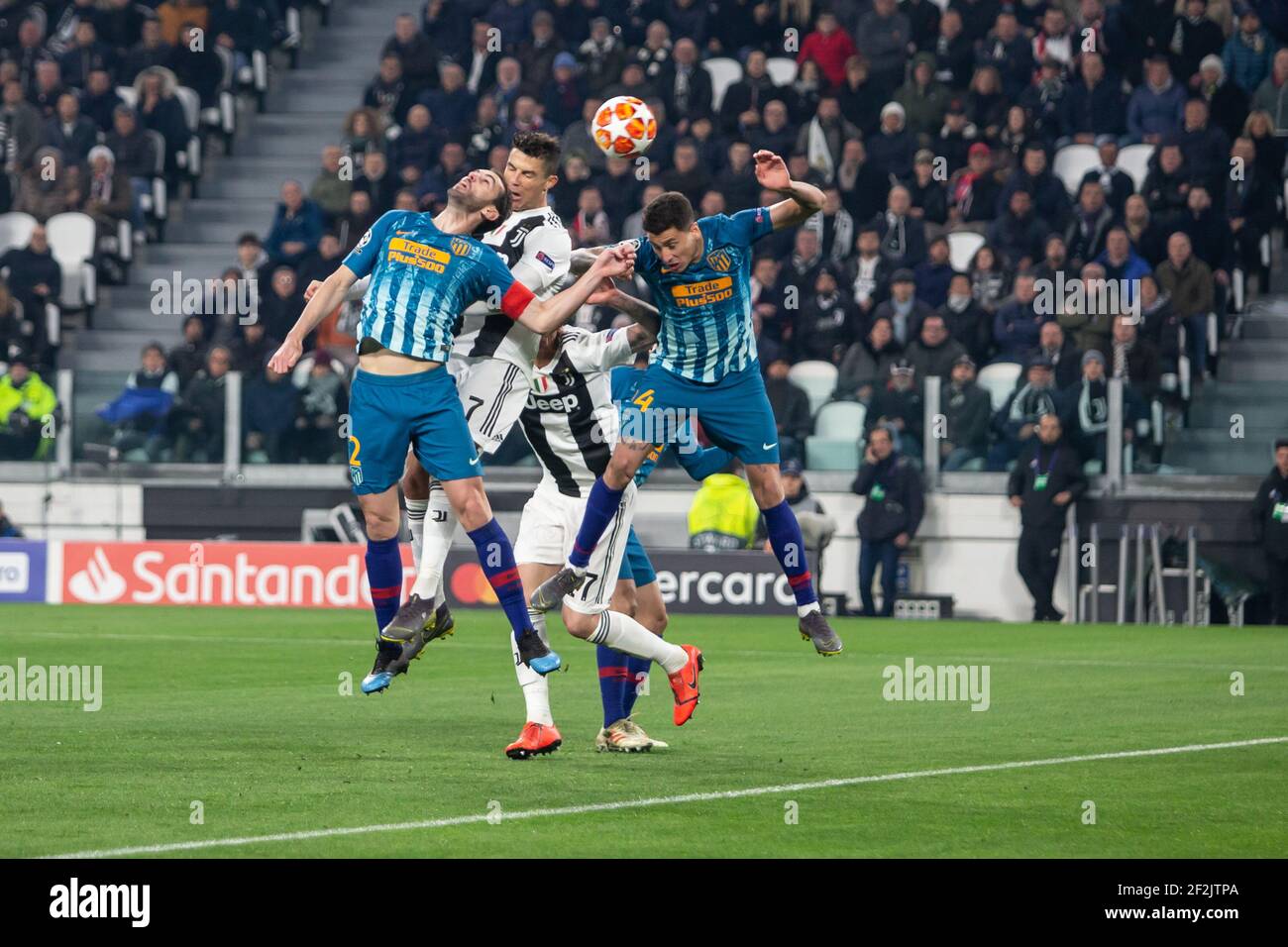 Cristiano Ronaldo of Juventus scores his second goal despite Diego Godin and Santiago Arias of Atletico during the UEFA Champions League, round of 16, 2nd leg football match between Juventus and Atletico de Madrid on March 12, 2019 at Juventus Stadium in Turin, Italy - Photo Morgese - Rossini / DPPI Stock Photo