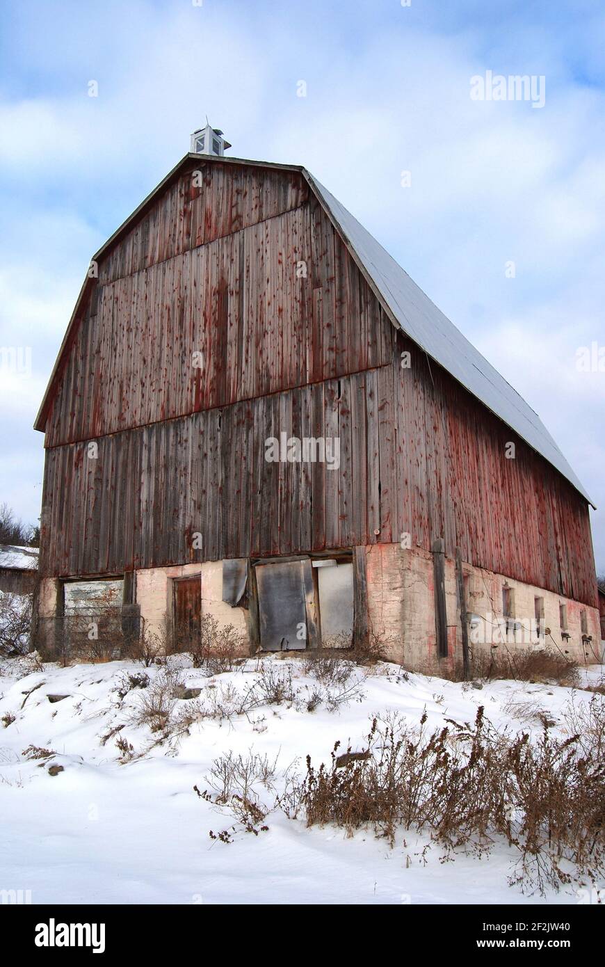 Old Abandoned Red Barn in Winter Landscape Verttical Stock Photo - Alamy