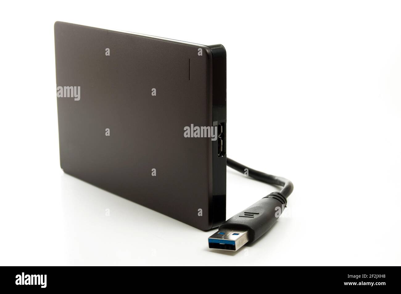 Black External Hard Drive for Computer Isolated on White Vertical Stock