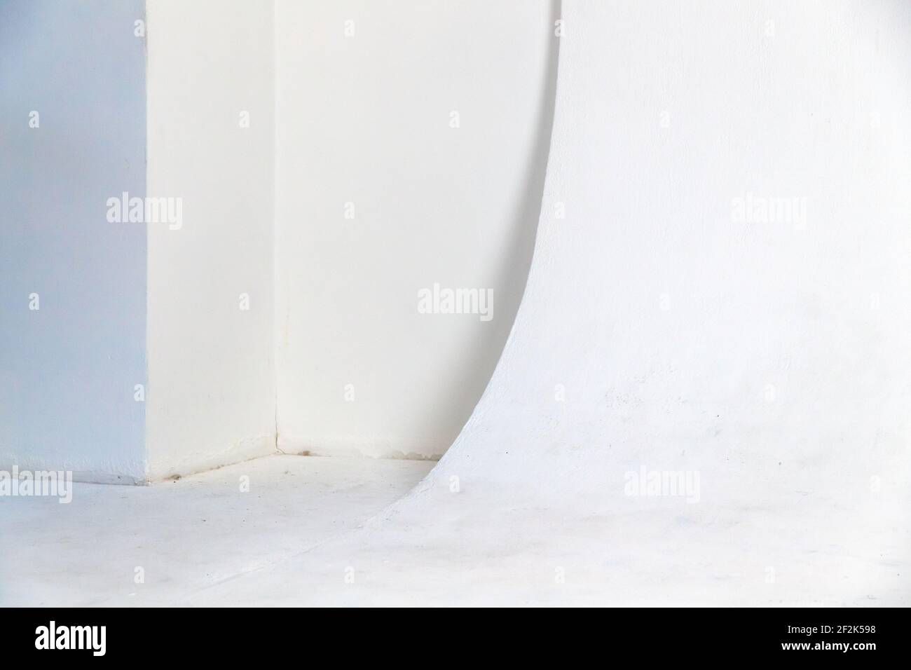 Abstract blank white photo studio interior, cyclorama structure with a smooth transition between horizontal and vertical planes. Background photo Stock Photo