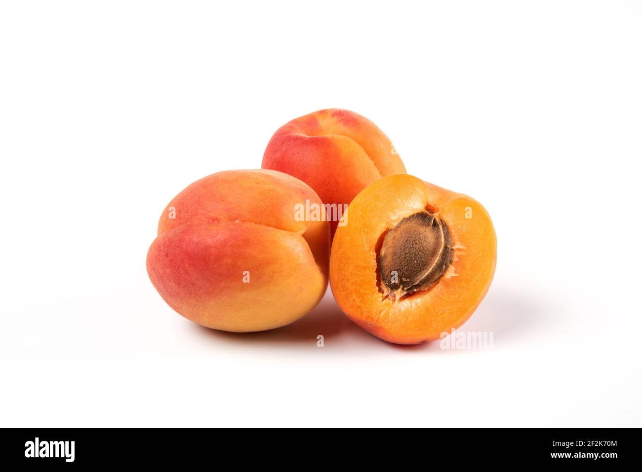 Organic apricots fruit isolated on white background Stock Photo - Alamy