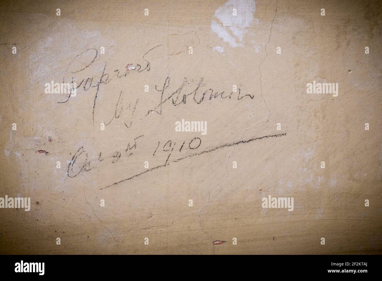 A signature on a wall in the Old Library, Bodmin, Cornwall, UK, 'Papered by F Solomon, Oct 9th 1910'. Stock Photo
