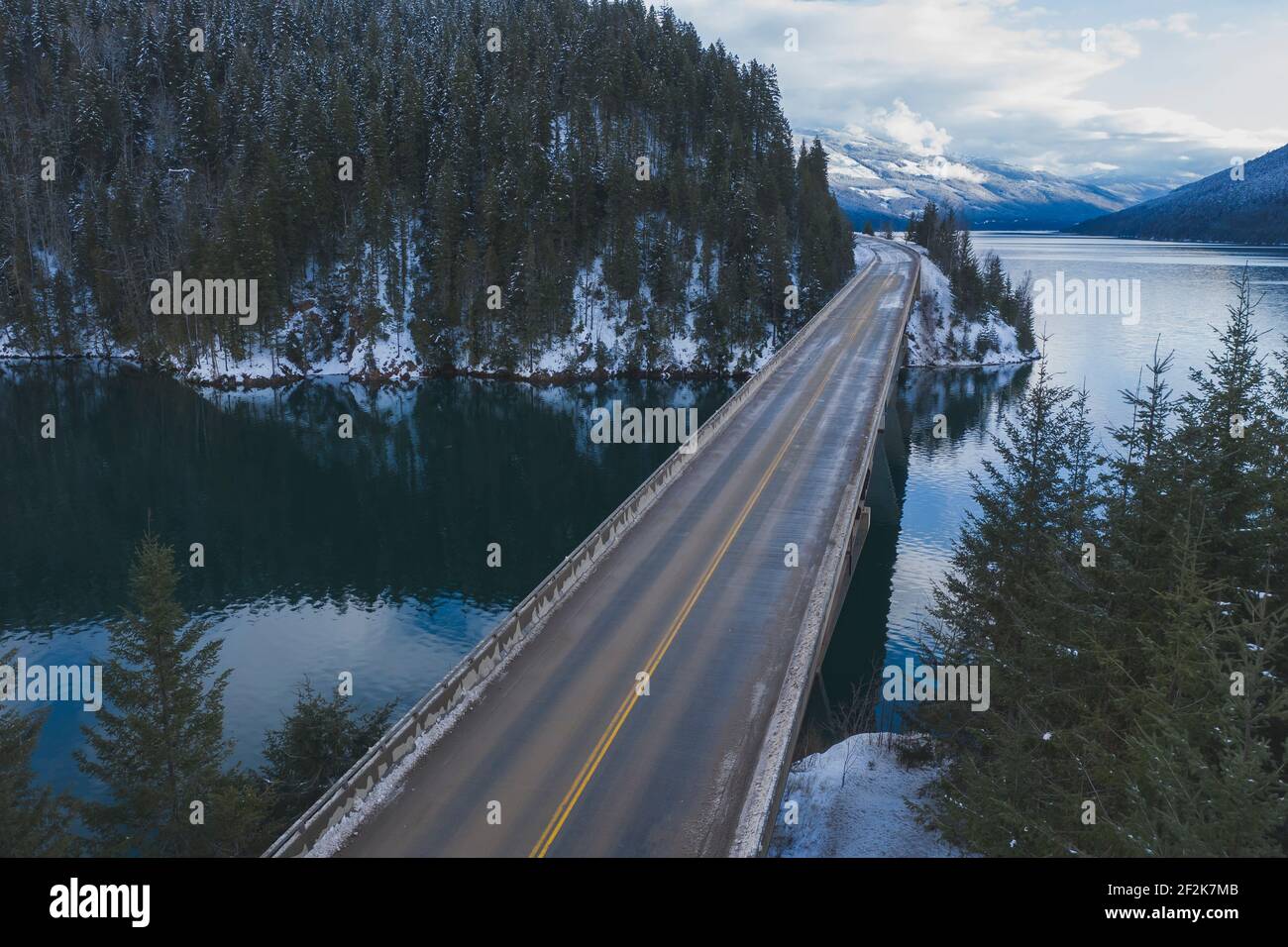 Empty bridge over river during winter Stock Photo