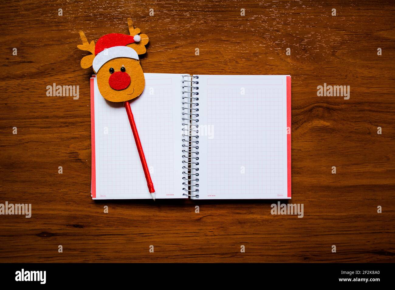 Notebook; pencil Papa Noel; red Stock Photo