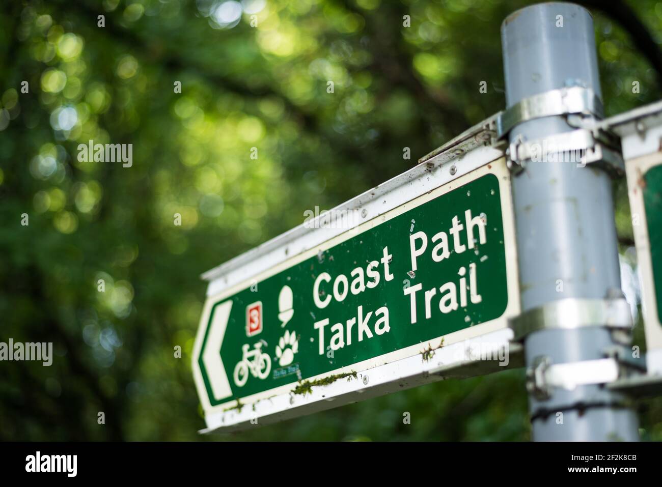 Signpost on the Tarka Trail footpath and cyclepath on the South West Coast Path at Fremington, Devon, UK. Stock Photo
