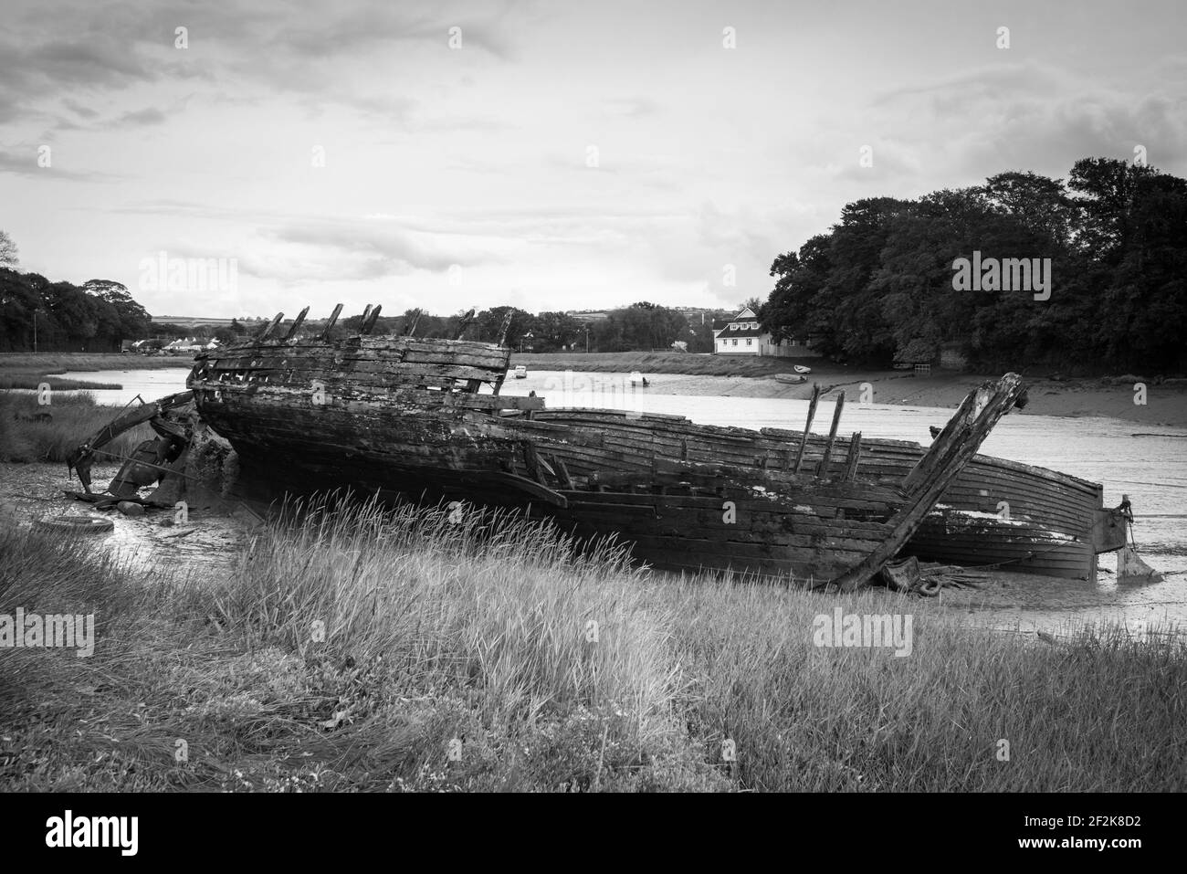 The wreck of a boat in Fremington Pill inlet, Devon, UK. Stock Photo