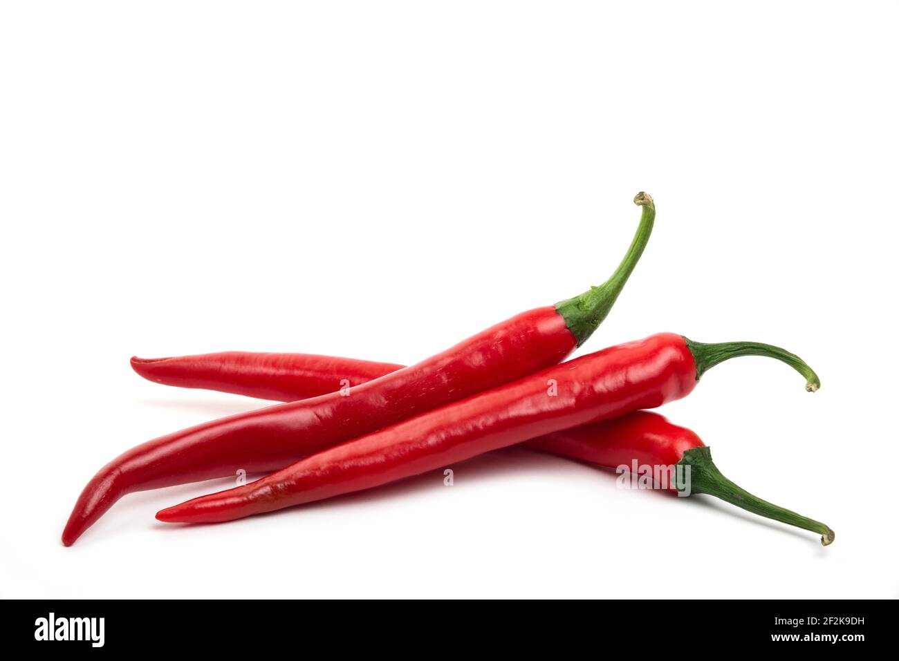 Red fresh chili peppers isolated on white background Stock Photo - Alamy