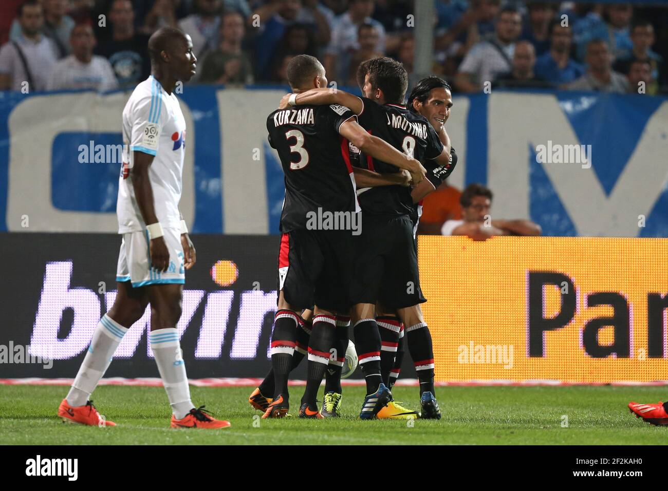 Football - French Championship 2013/2014 - Ligue 1 - Olympique de Marseille v AS Monaco on September 1 , 2013 in Marseille , France - Photo Manuel Blondeau / AOP PRESS / DPPI - Radamel Falcao of Monaco (R) celebrates with his teammates after scoring his sides first goal Stock Photo