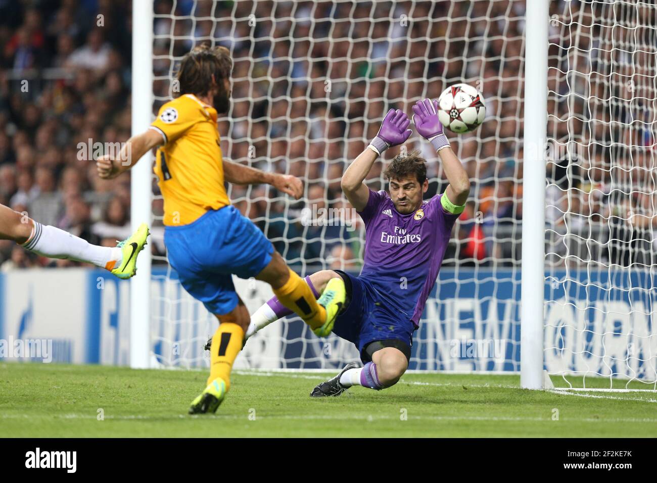 Football - UEFA Champions League 2013/2014 - Group Stage - Group B - Real Madrid v Juventus FC on October 23, 2013 in Madrid , Spain - Photo Manuel Blondeau / AOP PRESS / DPPI - Iker Casillas of Real Madrid saves a shot on goal from Andrea Pirlo of Juventus Stock Photo