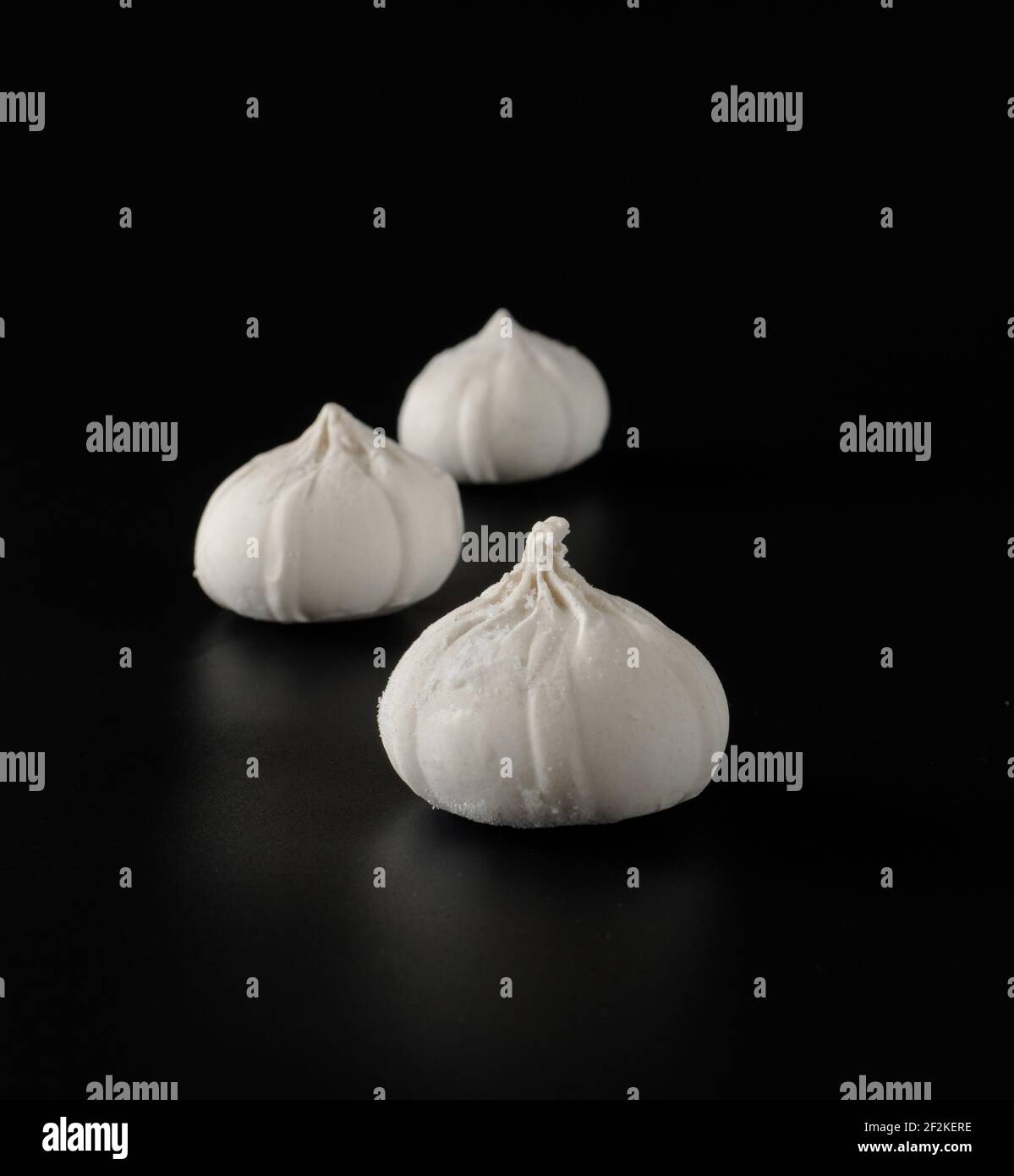 Khinkali with raw dough on a black background Stock Photo