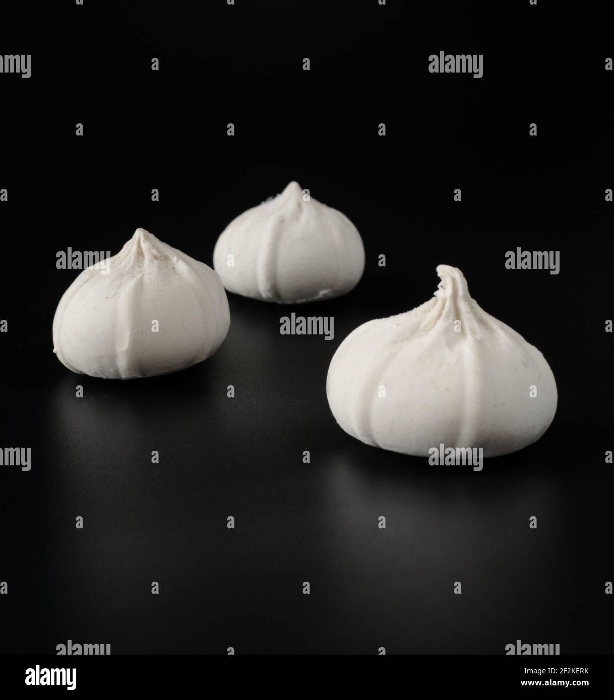 Khinkali with raw dough on a black background Stock Photo