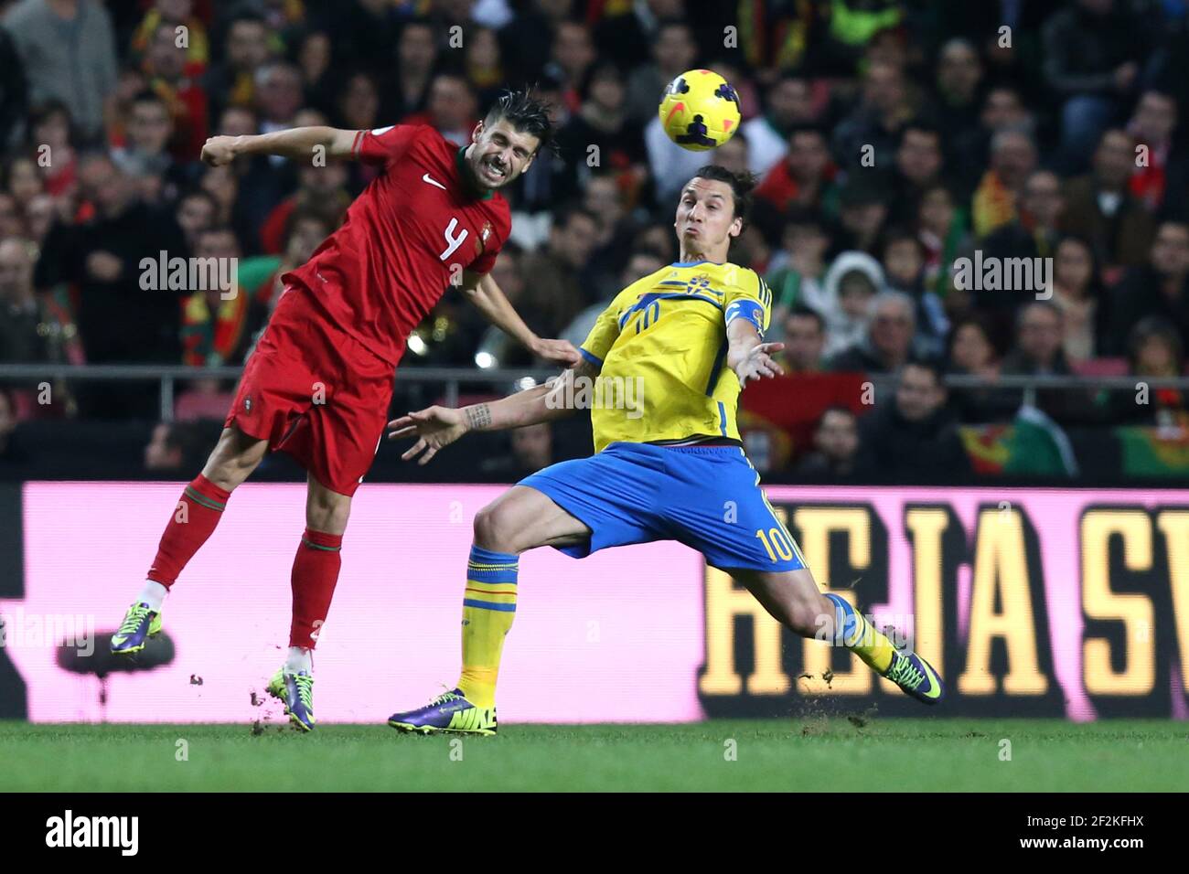 Football - FIFA World Cup 2014 - Qualifiying - Play Offs - 1st Leg - Portugal v Sweden on November 15, 2013 in Lisbon , Portugal - Photo Manuel Blondeau / AOP PRESS / DPPI - Miguel Veloso of Portugal duels for the ball with Zlatan Ibrahimovic of Sweden Stock Photo