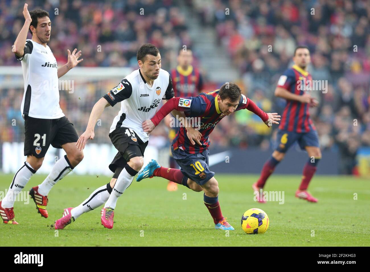 Football - Spanish Championship 2013/2014 - Liga - FC Barcelona v Valencia CF on February 1, 2014 in Camp Nou Stadium of Barcelona , Spain - Photo Manuel Blondeau / AOP PRESS / DPPI - Lionel Messi of FC Barcelona duels for the ball with Javi Fuego of Valencia CF Stock Photo