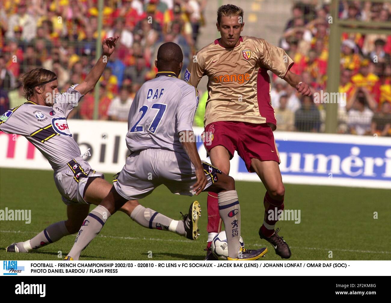 FOOTBALL - FRENCH CHAMPIONSHIP 2002/03 - 020810 - RC LENS v FC SOCHAUX -  JACEK BAK (LENS) / JOHANN LONFAT / OMAR DAF (SOC) - PHOTO DANIEL BARDOU /  FLASH PRESS Stock Photo - Alamy